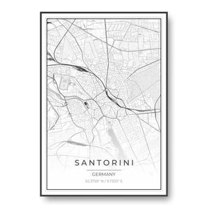 May include: A framed black and white map print featuring a detailed street grid layout. The text at the bottom reads SANTORINI, GERMANY, followed by the coordinates 52.3759 N / 9.7320 E. The design is enclosed in a thin black rectangular frame.