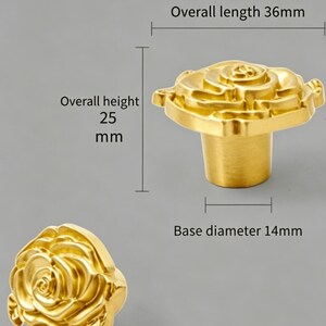 May include: A gold-colored metal cabinet knob shaped like a rose. The knob has an overall length of 36mm, an overall height of 25mm, and a base diameter of 14mm. The text on the image indicates these specific measurements for the hardware.