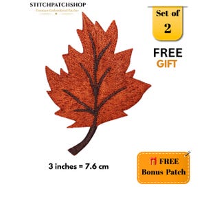 May include: An embroidered maple leaf patch in shades of burnt orange and brown with dark brown vein detailing. The patch measures 3 inches or 7.6 cm. Text on the image includes STITCHPATCHSHOP, Set of 2 FREE GIFT, and FREE Bonus Patch.