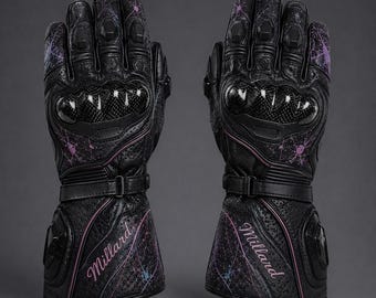 May include: A pair of black leather motorcycle gloves featuring carbon fibre knuckle protectors, perforated leather panels, and adjustable wrist straps. The gloves are decorated with purple and blue splatter patterns and the word Millard in script.