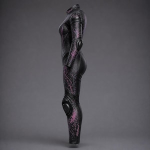 May include: A black motorcycle racing suit featuring a high collar, long sleeves, and integrated protective armour on the shoulders, elbows, and knees. The suit is decorated with a purple and pink splatter pattern and the word Millard in pink.