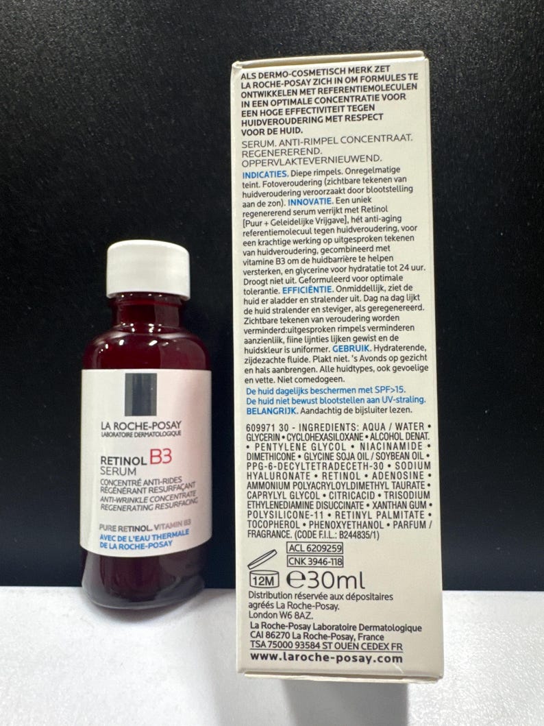 May include: A 30ml bottle of La Roche-Posay Retinol B3 serum with a white cap and a white label featuring black and red text, positioned next to its rectangular cardboard packaging box which displays detailed product information and ingredients.