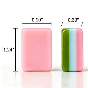 May include: Two rectangular tiles with rounded corners. The left tile is solid pink and measures 0.90 inches wide by 1.24 inches high. The right tile features vertical stripes of green, light blue, and pink, measuring 0.63 inches wide.