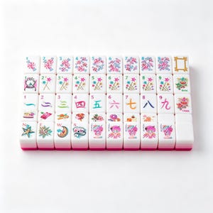 May include: A set of white mahjong tiles with pink bases, featuring colorful illustrations of candies, stars, numbers, Chinese characters, and whimsical characters. The tiles are arranged in a grid, displaying various icons including sweets, wands, and text.