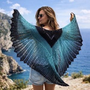 May include: A triangular crochet shawl featuring an ombre color gradient that transitions from a solid black center to a vibrant teal and back to black at the scalloped edges. The accessory has an intricate openwork lace pattern throughout.