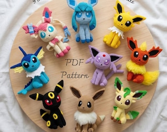 May include: A collection of nine crocheted amigurumi figures representing various creatures, including Eevee and its evolutions. The text 9 in 1 Eeveelutions Crochet Pattern Bundle, PDF Pattern, and Low Sew are visible on the circular wooden display.