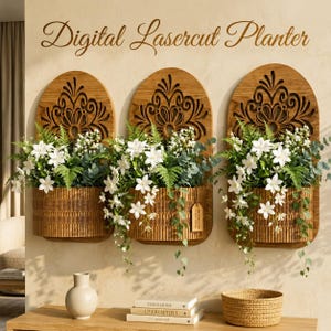 May include: Three arched wooden wall planters with intricate laser-cut floral patterns at the top and vertical slats on the base. Each planter is filled with white flowers and green foliage. The text Digital Lasercut Planter is above them.