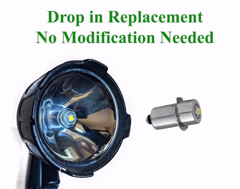 May include: A close-up of a black flashlight with a bright white LED bulb. The image also shows a replacement LED bulb, which is a small, silver-colored component with a white LED bulb. The text "Drop in Replacement No Modification Needed" is displayed above the image.