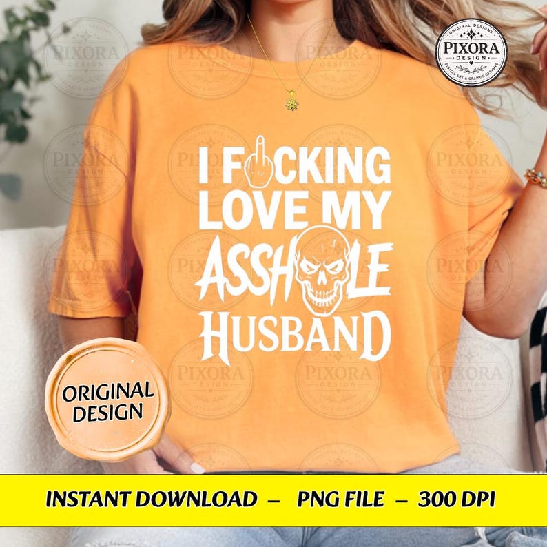 May include: An orange short-sleeved t-shirt featuring white text that reads I FOCKING LOVE MY ASSHOLE HUSBAND, with a graphic of a middle finger replacing the letter O and a skull illustration replacing the letter O in the word ASSHOLE.