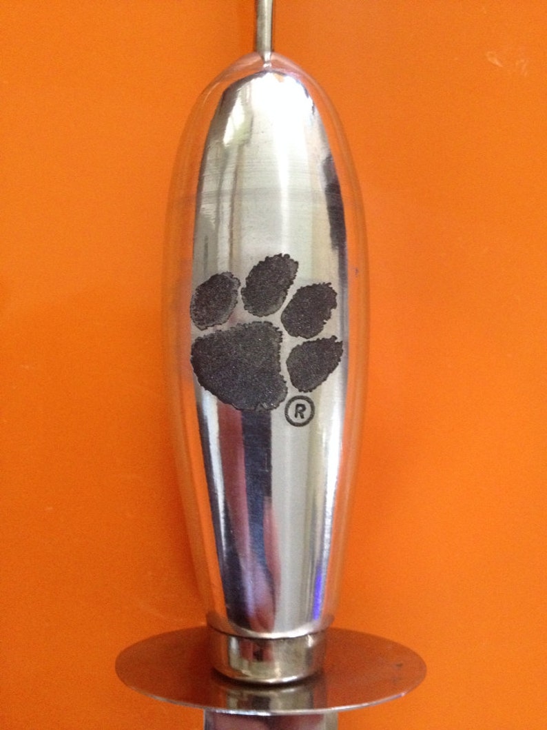 All in one collegiate licensed Clemson seafood utensil!