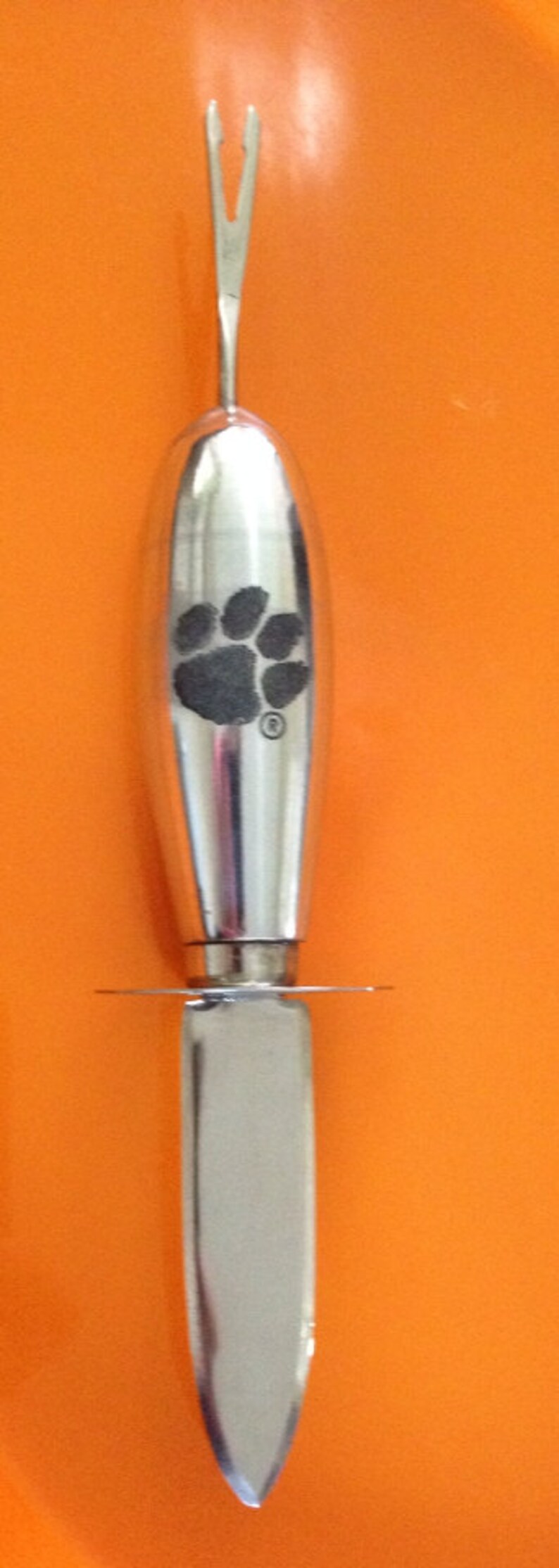 All in one collegiate licensed Clemson seafood utensil!