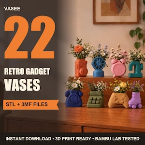 May include: A collection of eight small, colorful vases shaped like retro gadgets, including a camera, fan, alarm clock, telephone, typewriter, game controller, and roller skate, each holding a small bouquet of flowers and text reading VASEE 22.