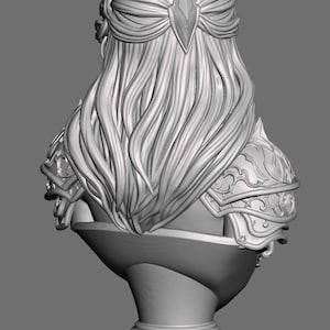May include: A gray 3D digital model of a bust featuring a figure with long flowing hair, a crown with pointed spikes, and ornate shoulder armor. The figure is mounted on a fluted pedestal base, presented from a rear-facing perspective.
