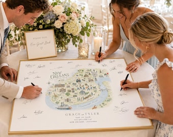 Puede incluir: Un tablero de firmas para libro de visitas cuadrado con marco dorado que presenta un mapa ilustrado de Nueva Orleans, el río Misisipi y el texto Grace and Tyler, June 24, 2028, The Spotted Cat, New Orleans, Louisiana, rodeado de firmas manuscritas.