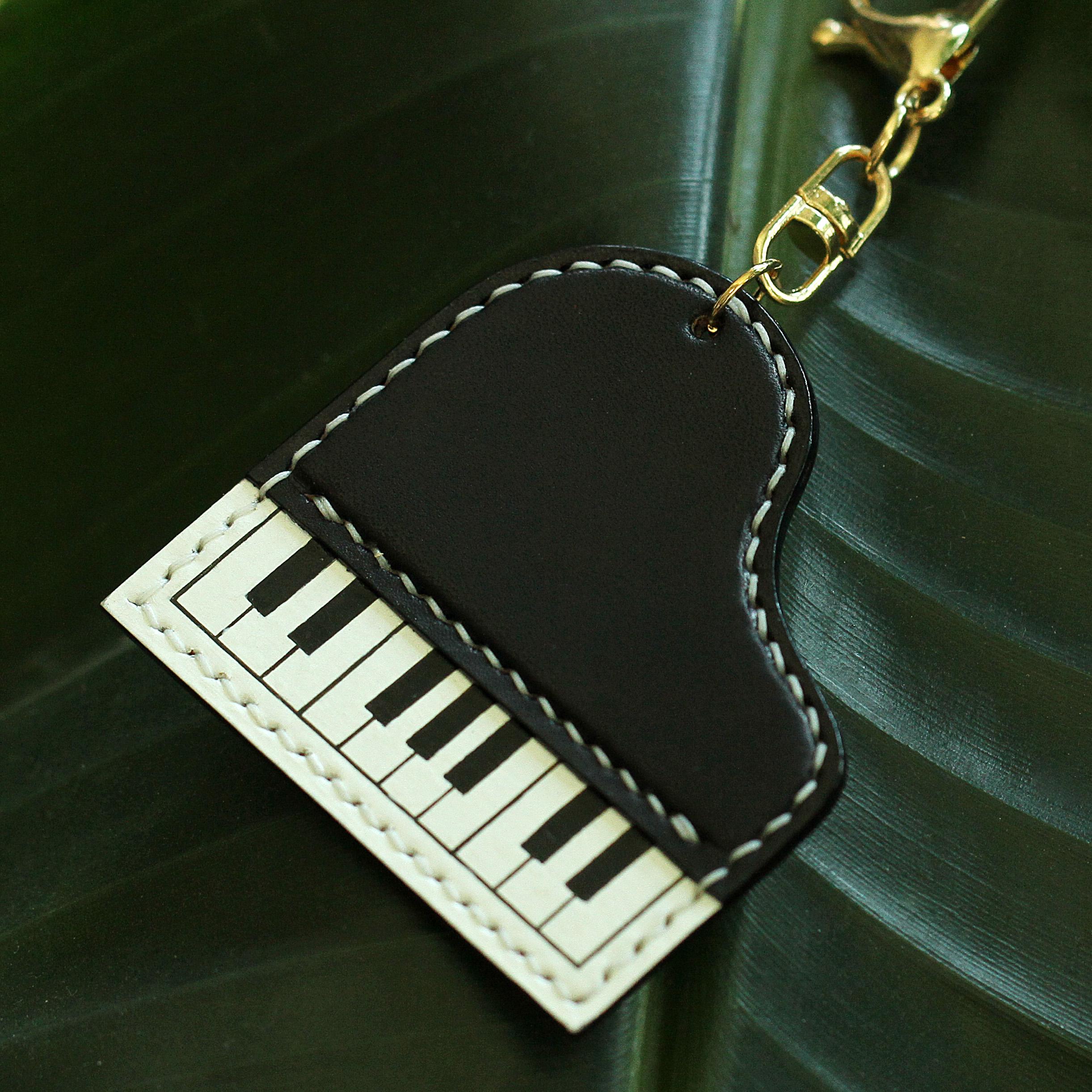 Nuovo portachiavi tastiera, pianoforte, note musicali