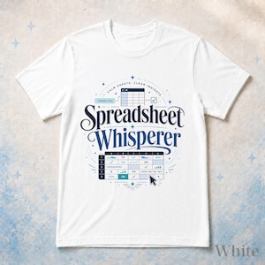 May include: A white short-sleeve t-shirt featuring a dark blue graphic with the text "Spreadsheet Whisperer" and "CALM SHEETS, CLEAR INSIGHTS." The design includes a spreadsheet grid, data charts, a cursor icon, and small star accents.