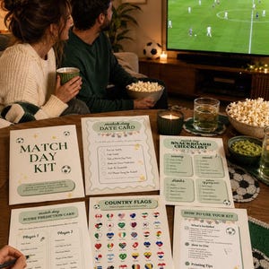 May include: A match day kit consisting of six printed paper sheets including a date card, snackboard checklist, score prediction card, country flags chart, and instructions, all featuring soccer-themed graphics and text on a wooden table.