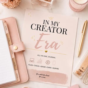 May include: A light pink journal cover titled IN MY CREATOR Era with a small crown icon, a gold heart, and icons for plan, track, grow, earn, and inspire. The text reads: ALL-IN-ONE JOURNAL, PLAN, TRACK, GROW, EARN, INSPIRE, and Your content. Your brand. Your success.