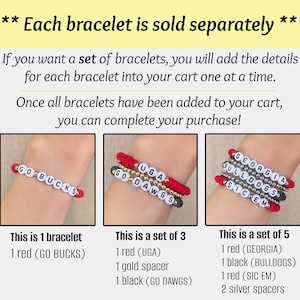 Puede incluir: Tres pulseras de cuentas con cuentas de letras blancas que deletrean "GO BUCKS", "UGA GO DAWGS" y "GEORGIA BULLDOGS SIC EM". Las pulseras son rojas, negras y plateadas, con espaciadores dorados. El texto dice que cada pulsera se vende por separado.