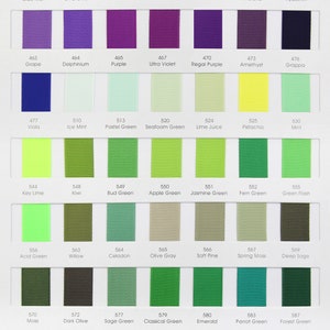 May include: A color chart of 36 different colors of ribbon. The colors are arranged in rows and columns, with each color labeled with a number and a name. The colors include lilac mist, light orchid, fresco, thistle, iris, wisteria, hyacinth, grape, delphinium, purple, ultra violet, regal purple, amethyst, grappa, viola, ice mint, pastel green, seafoam green, lime juice, pistachio, mint, key lime, kiwi, bud green, apple green, jasmine green, fern green, green flash, acid green, willow, celadon, olive gray, soft pine, spring moss, deep sage, moss, dark olive, sage green, classical green, emerald, parrot green, forest green, hunter, spruce, neon orange, chamois, baby maize, pineapple, and lemon.