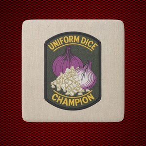 May include: A square coaster with a beige surface featuring a centered dark green emblem. The emblem displays two purple onions and a pile of diced white onion pieces, with the yellow text UNIFORM DICE CHAMPION arched around the graphic.