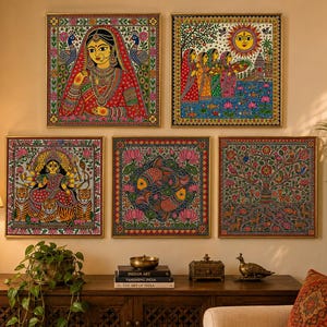 May include: A set of five square wall art prints featuring intricate folk-style illustrations. The collection includes depictions of a woman in traditional attire, a sunlit river scene, a multi-armed deity with tigers, two fish, and a tree of life.