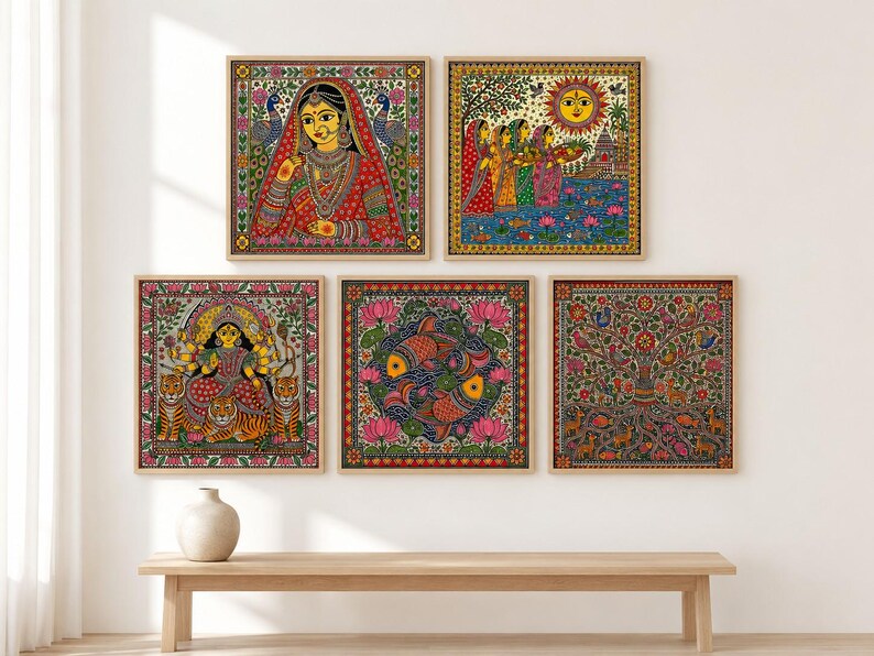 May include: A set of five square framed wall art prints featuring vibrant Madhubani style illustrations. The collection includes a portrait of a person in traditional attire, a sunlit river scene, a deity with tigers, two fish, and a tree of life.