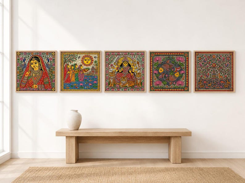 May include: A set of five square wall art prints featuring intricate, colorful folk-style illustrations. The designs depict a woman in traditional attire, a group of figures under a sun, a multi-armed deity with tigers, two fish, and a tree of life.