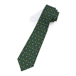May include: A dark green necktie featuring a repeating pattern of small blue shield-shaped emblems, yellow triangles, white vertical bars, and rows of four small yellow dots arranged in a structured, geometric grid across the fabric surface.