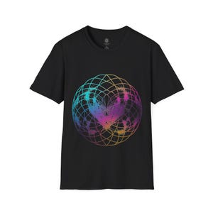 May include: A black short-sleeve t-shirt featuring a large, circular geometric design on the chest. The graphic consists of intersecting lines in a gradient of blue, purple, pink, and orange, with a textured, splattered effect in the center.