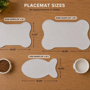 May include: A graphic showing placemat sizes in inches. Two light gray bone-shaped placemats measure 19 by 14 inches and 30 by 18 inches. One light gray fish-shaped placemat measures 19 by 14 inches. Two white bowls are included for scale.