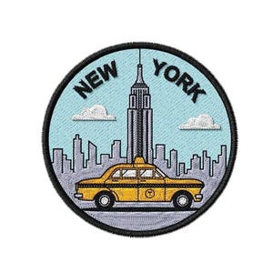 May include: A circular embroidered patch featuring a light blue sky background with a grey skyline of New York City, including the Empire State Building. A yellow taxi cab is centered in the foreground. The text NEW YORK is arched above.