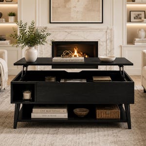 May include: A black wooden lift-top coffee table with a rectangular design, featuring a raised top surface, an open storage compartment, and a lower shelf. The table includes a side cubby, four tapered legs, and holds books titled Live Beautifully.