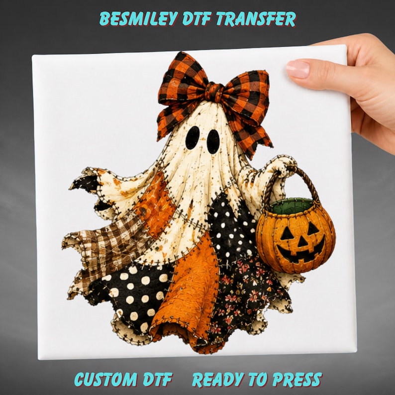 May include: A Besmiley DTF Transfer featuring a ghost character with a large orange and black plaid bow, wearing a patchwork-style sheet with black and white polka dots and orange fabric, holding an orange jack-o'-lantern candy bucket.