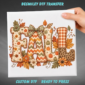 May include: A Besmiley DTF transfer featuring the word FALL in large letters decorated with autumn patterns including orange flowers, green chevron stripes, pumpkins, orange gingham, and leopard print, accented by a plaid bow and leaves.