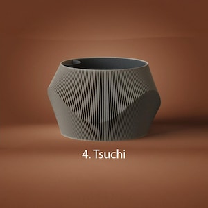 May include: A gray, faceted planter with a vertical ribbed texture on the exterior and a smooth, dark interior. The object is labeled with the text 4. Tsuchi, which is printed in white below the base of the planter on the solid brown background.