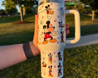 Vaso térmico de acero inoxidable de 1,2 litros con asa y diseño de personaje de dibujos animados.