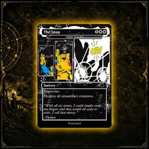 May include: A black trading card titled The Snap featuring a comic-style illustration of a yellow gauntlet with colorful stones. The card text reads Improvise, Destroy all nonartifact creatures, and includes a quote by Thanos about the six stones.