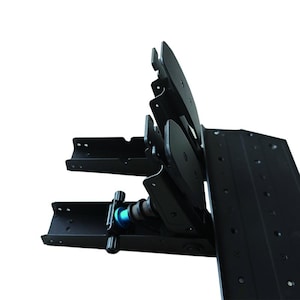 May include: A black metal racing pedal set featuring three upright pedals with textured surfaces. The assembly includes a base plate with multiple mounting holes and a visible blue adjustment knob on the side mechanism for tension control.