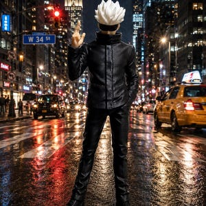 May include: A collectible action figure of a character with spiky white hair and a black blindfold, wearing a black high-collar jacket and matching trousers. The figure stands in a pose with one hand raised, set against a blurred city street background.