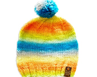 hand knit hat with pom-pom