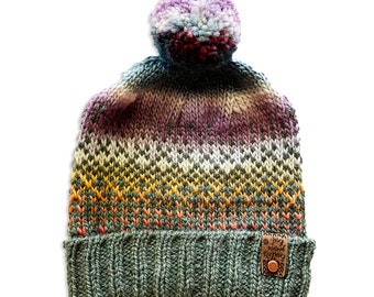 hand knit hat with removable pom-pom