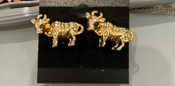 Gold bull pierced earrings - image 1