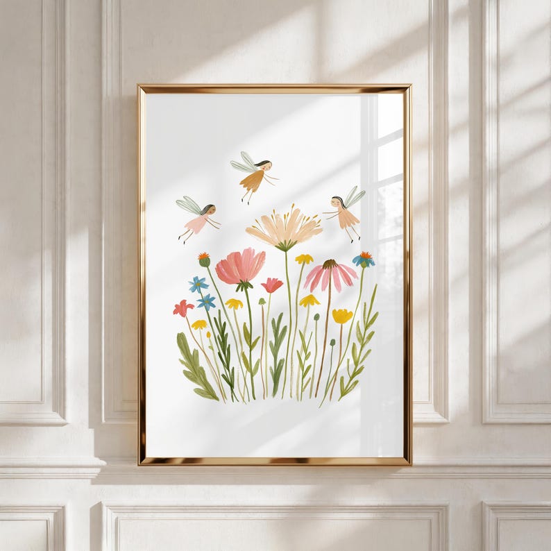 May include: A framed wall art print featuring a white background with a colorful illustration of various wildflowers in shades of pink, yellow, and blue, accompanied by three small winged fairy figures flying above the floral arrangement.