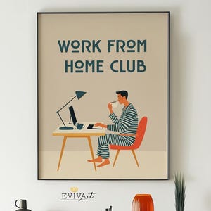 May include: A framed art print with the text "WORK FROM HOME CLUB" above an illustration of a person working at a desk. The person is wearing striped pajamas and sitting in an orange chair. A wooden dresser with drawers is below the print.