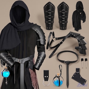 May include: A black hooded cloak, layered shoulder armor, and forearm bracers with metal rings. Includes a belt, a leather potion holder with a blue liquid glass bottle, a separate shoulder strap, and two metal safety pins for secure attachment.