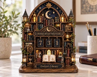 May include: A decorative wooden book tracker display featuring a miniature library with illuminated shelves, a crescent moon, and stars. It includes three hanging number tiles showing 731, with the text BOOKS READ THIS YEAR and Evelyn's Library.