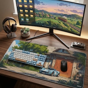 May include: A desk setup featuring a curved monitor displaying a landscape, a mechanical keyboard with blue and white keycaps, a black wireless mouse, and a large rectangular desk mat printed with a vintage car and a wooden barn scene.