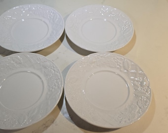 Set of 5 Mikasa English Countryside saucers featuring a classic white embossed fruit and basketweave design