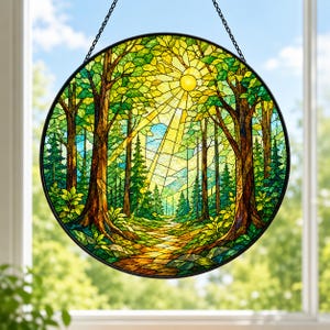 May include: A circular stained glass suncatcher featuring a forest scene with tall trees, a winding path, and a bright yellow sun radiating light beams. The design uses various shades of green, brown, and yellow glass pieces held by a black frame.